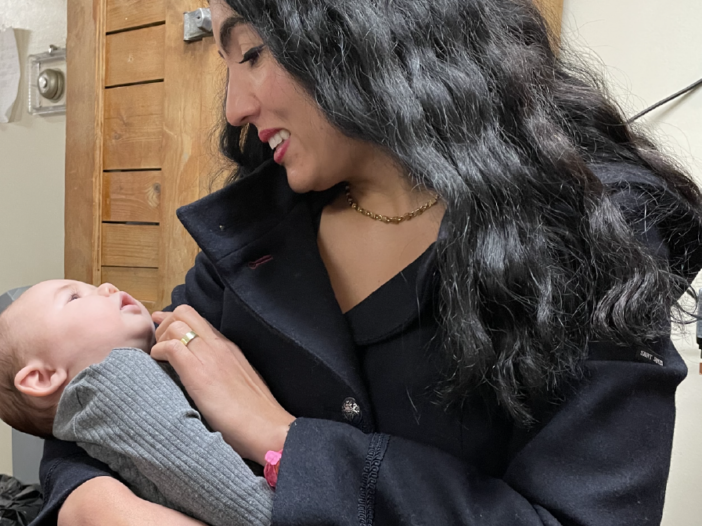 Gisele Fetterman holds a baby at Sojourner House