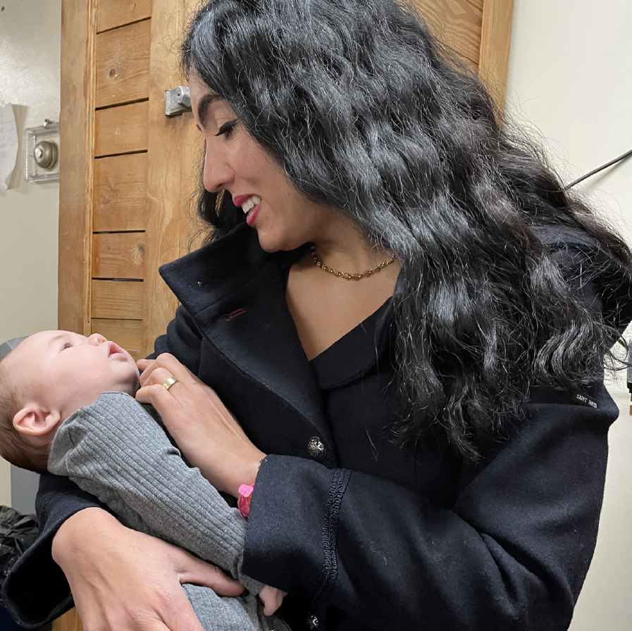 Gisele Fetterman holds a baby while visiting Sojourner House