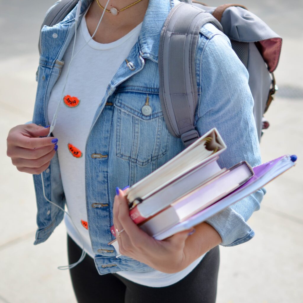 Student Heads Back To School With Books and Backpack