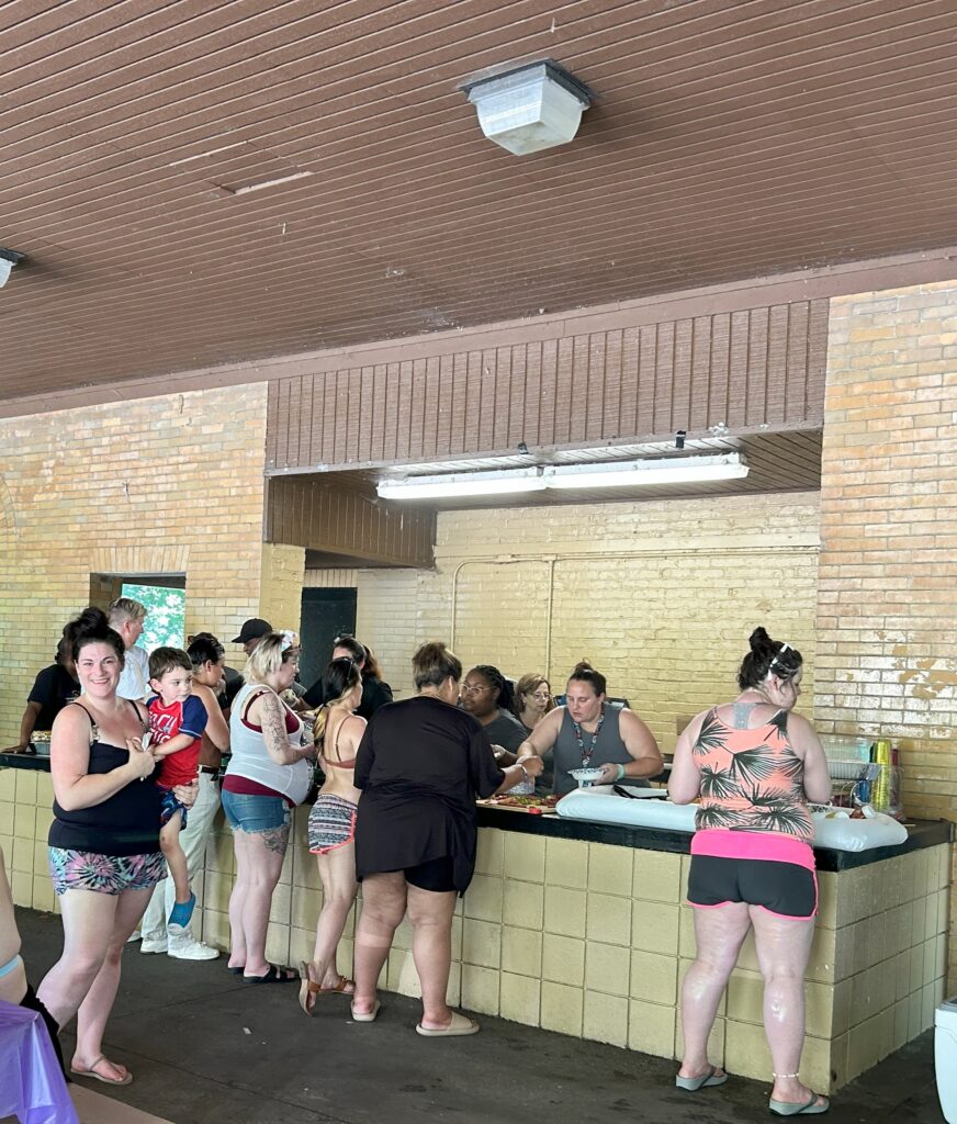 Sojourner House and Sojourner House MOMS families in line for food at the Sista to Sista picnic